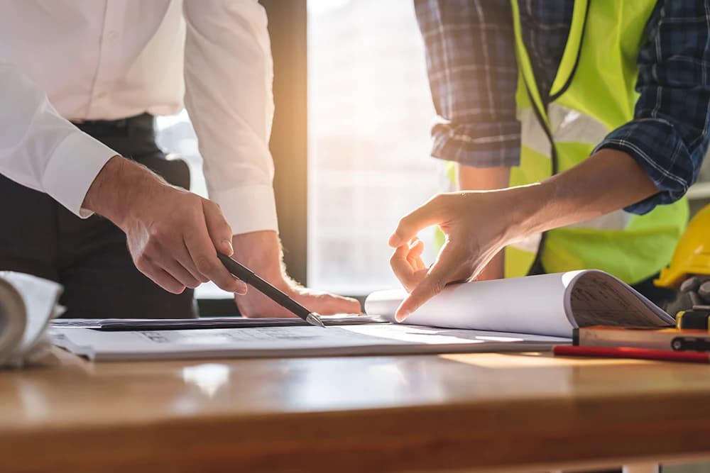 An engineer reviewing project drawings
